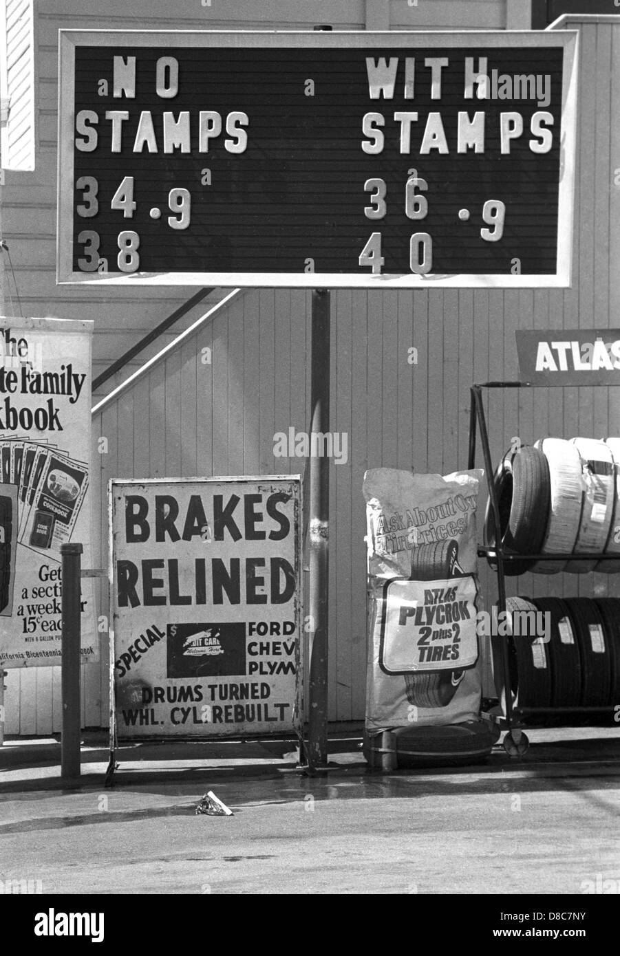 sign on gas station in 1970s tell motorists that 34 cent gasoline is