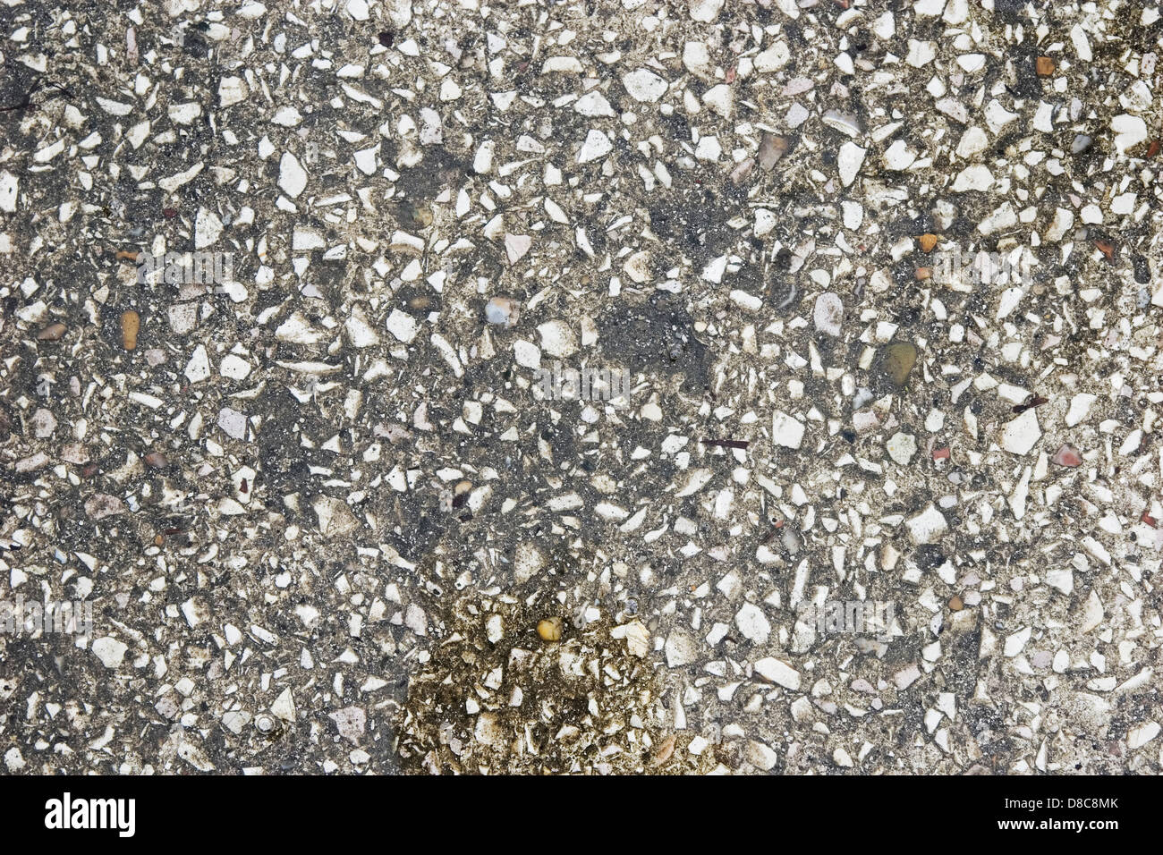 texture of wet concrete road with bubbles on the water closeup Stock