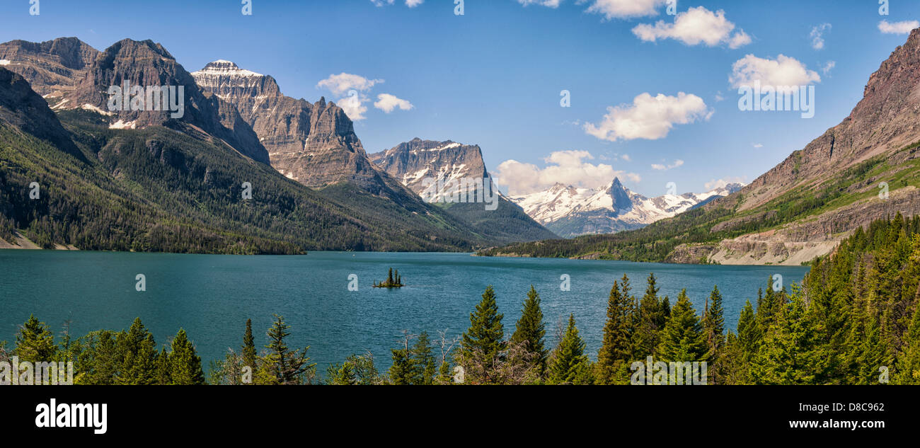 Panoramic Image Of Lake Saint Mary Surrounded By Mountain Peaks In panoramic-image-of-lake-saint-mary-surrounded-by-mountain-peaks-in