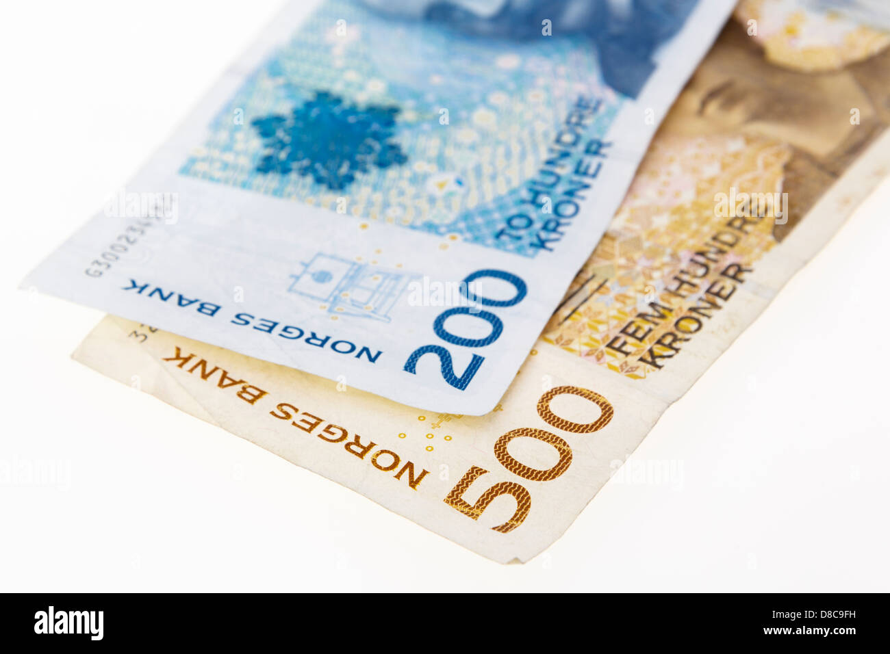 Two Norwegian 200 and 500 Kroner banknotes on a plain white background ...