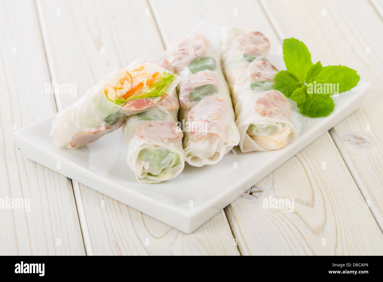 Bo Bia - Vietnamese fresh summer rolls with Chinese sausage, jicama, carrots, lettuce, egg and dried shrimp. Stock Photo