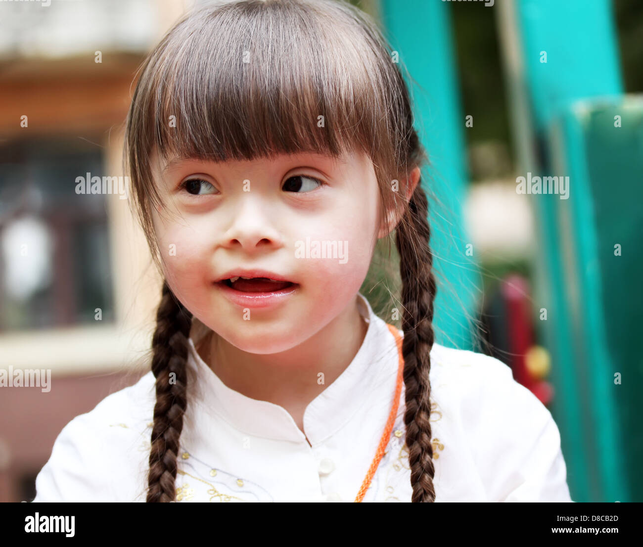 Portrait of beautiful happy girl on the playground Stock Photo - Alamy