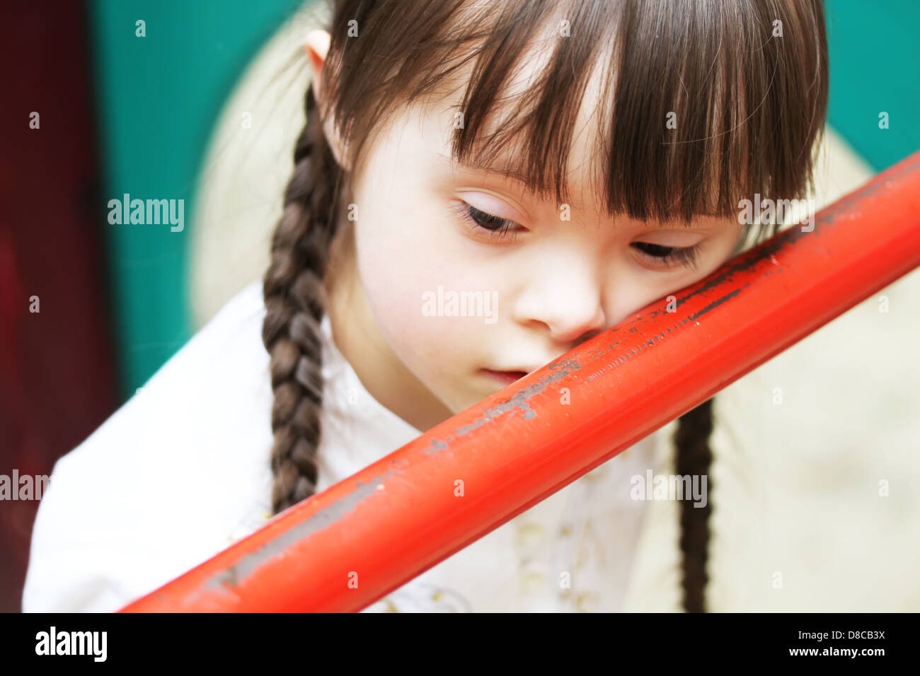 Portrait of beautiful young girl on the playground Stock Photo - Alamy