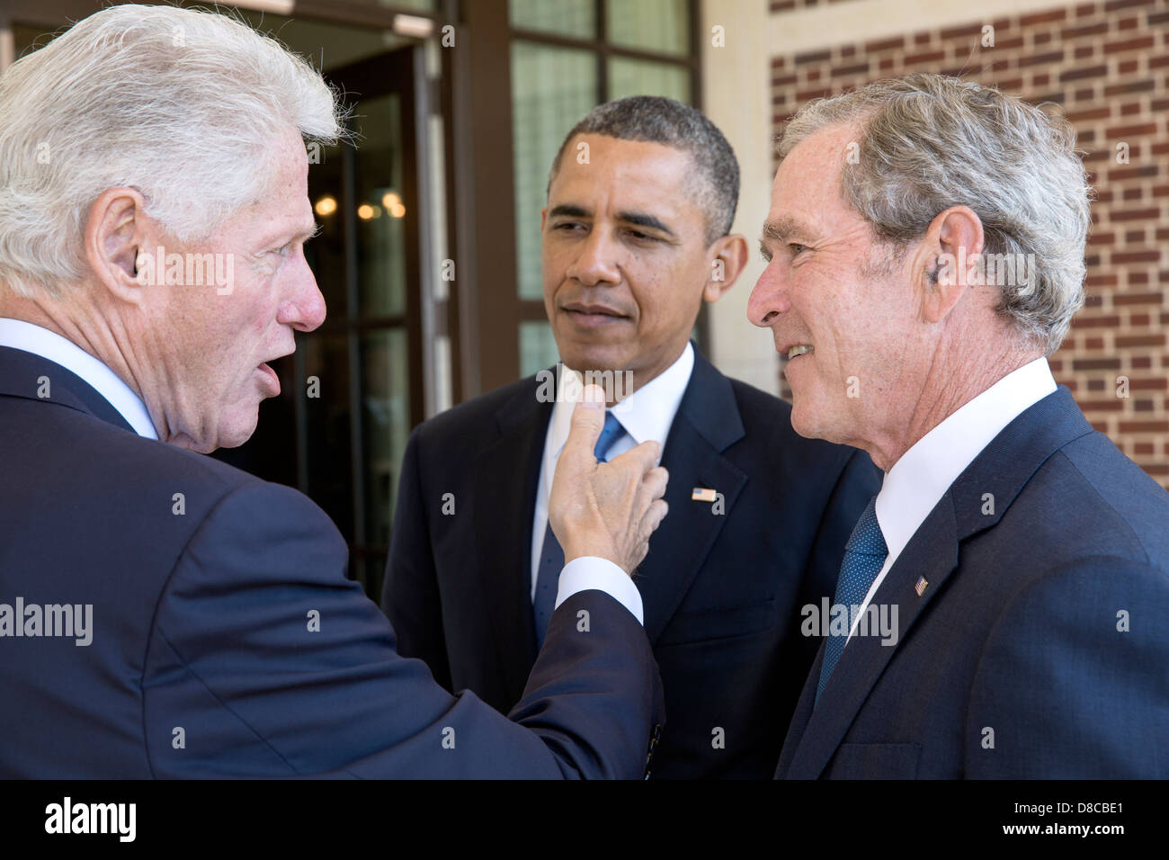 US President Barack Obama talks with former Presidents Bill Clinton and George W. Bush before a luncheon at the George W. Bush Presidential Library and Museum on the campus of Southern Methodist University April 25, 2013 in Dallas, Texas. Stock Photo