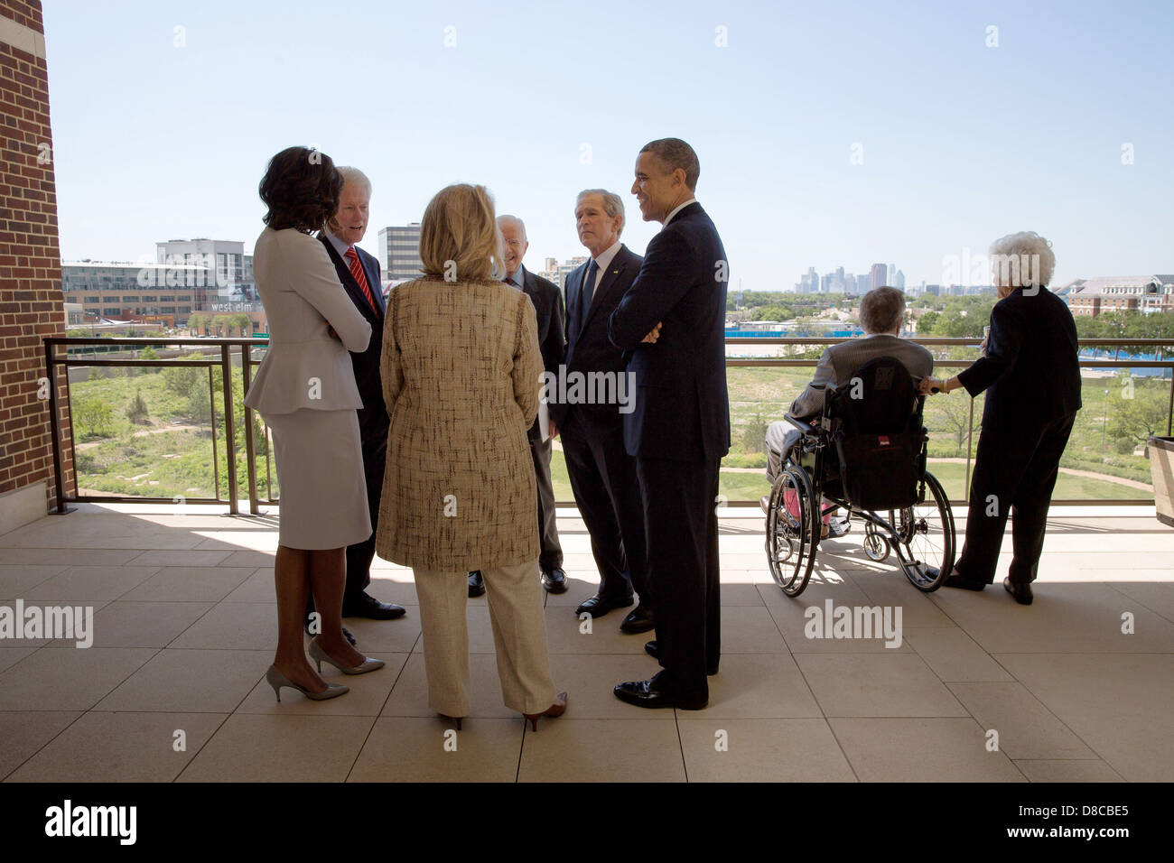 US President Barack Obama and First Lady Michelle Obama talk with former Presidents and First Ladies before a luncheon at the George W. Bush Presidential Library and Museum on the campus of Southern Methodist University in Dallas, Texas, April 25, 2013. Pictured, from left, are: Bill Clinton, Hillary Rodham Clinton, Jimmy Carter, and George W. Bush. George H.W. Bush and Barbara Bush talk at right. Stock Photo