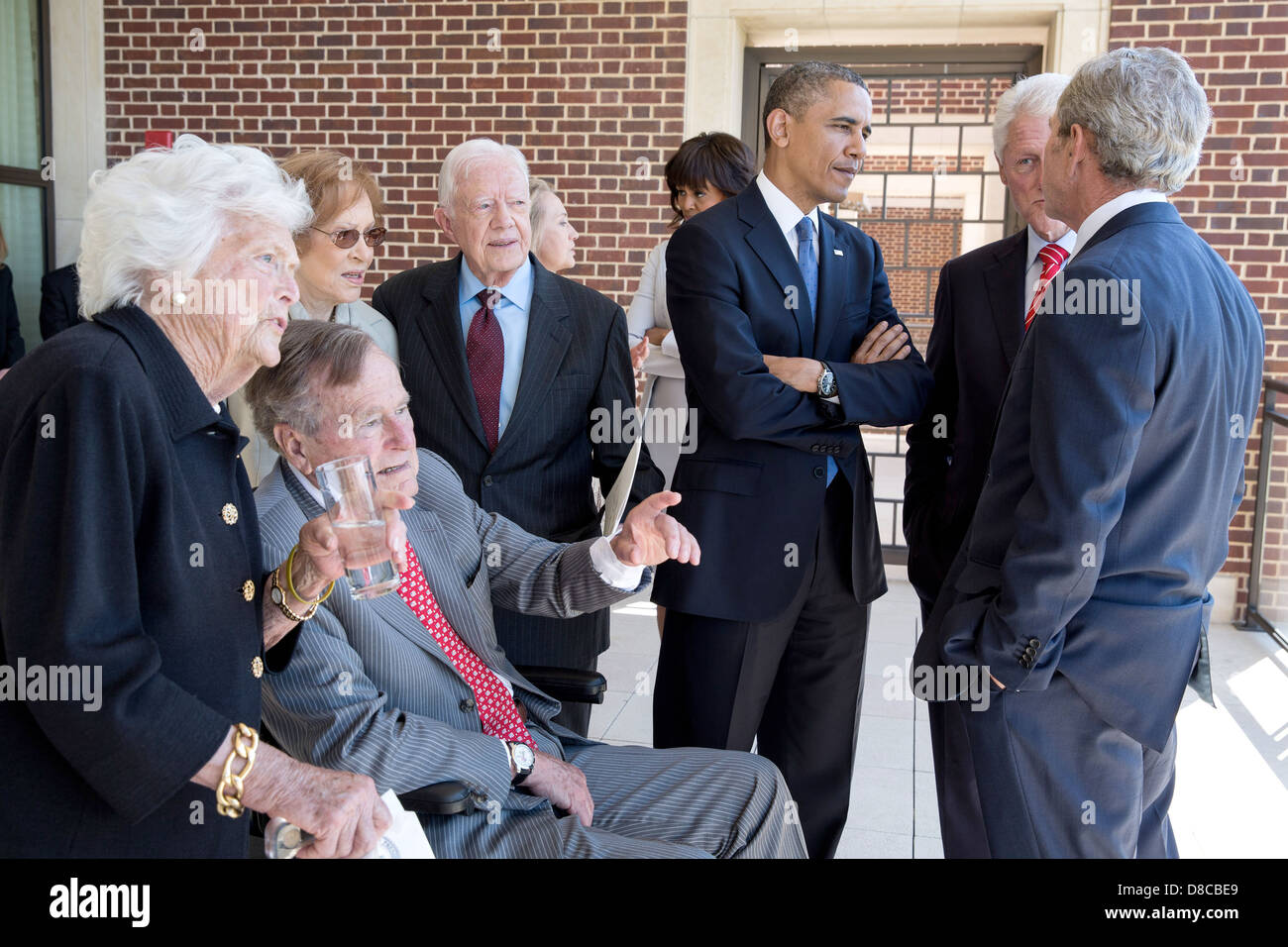 US President Barack Obama and First Lady Michelle Obama talk with former Presidents and First Ladies before a luncheon at the George W. Bush Presidential Library and Museum on the campus of Southern Methodist University April 25, 2013 in Dallas, Texas. Pictured, from left, are: Barbara Bush, George H.W. Bush, Rosalynn Carter, Jimmy Carter, Hillary Rodham Clinton, Bill Clinton, and George W. Bush. Stock Photo