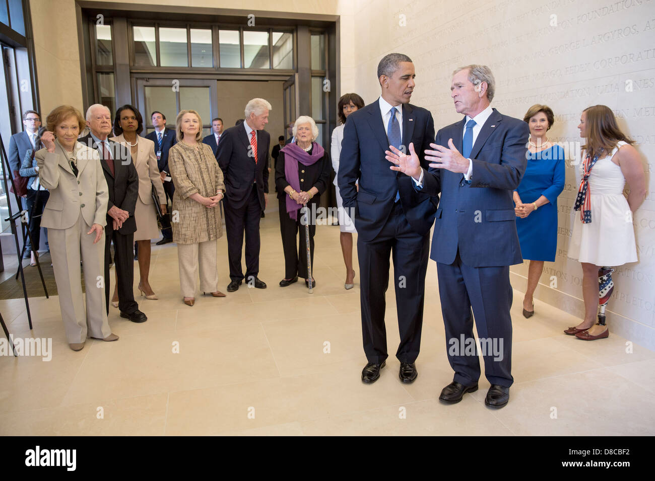 US President Barack Obama talks with former President George W. Bush prior to the dedication of the George W. Bush Presidential Library and Museum on the campus of Southern Methodist University April 25, 2013 in Dallas, Texas. Stock Photo