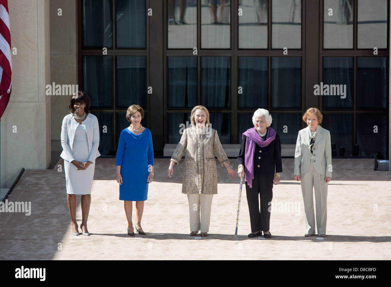 US First Lady Michelle Obama stands with former First Ladies Laura Bush, Hillary Rodham Clinton, Barbara Bush and Rosalynn Carter during the dedication of the George W. Bush Presidential Library and Museum on the campus of Southern Methodist University April 25, 2013 in Dallas, Texas. Stock Photo