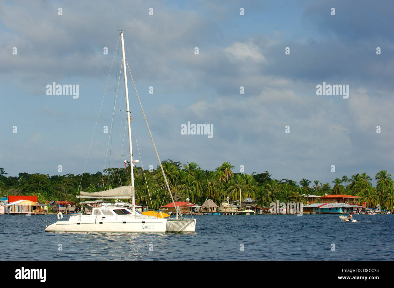 Catamaran sail boat moored at the shore Stock Photo