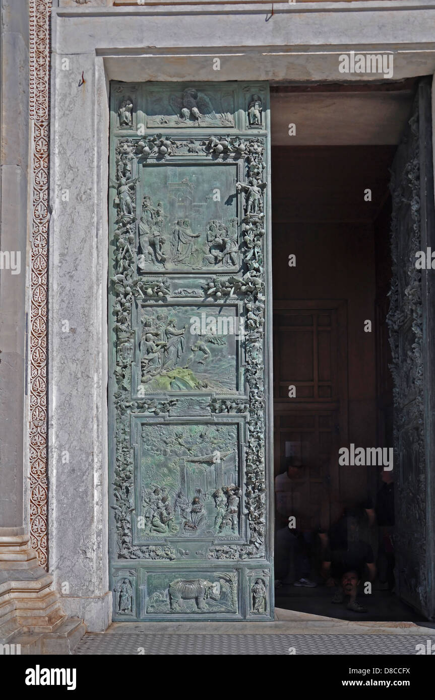 The massive bronze door of the basilica. The depicts stories from the