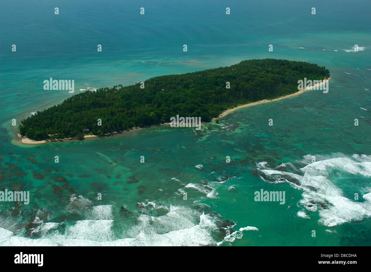 Aerial view of white waves coming to Zapatilla Cay shore Stock Photo