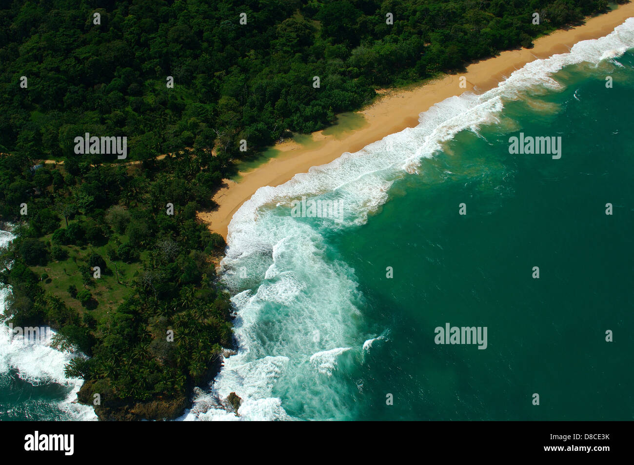 Aerial view of white waves coming to island shore Stock Photo