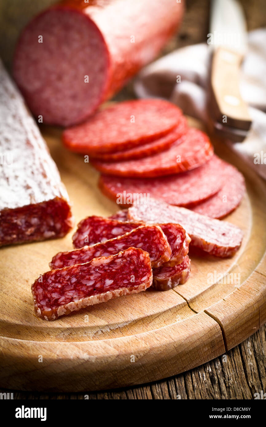 https://c8.alamy.com/comp/D8CM6Y/gourmet-sliced-salami-on-kitchen-table-D8CM6Y.jpg