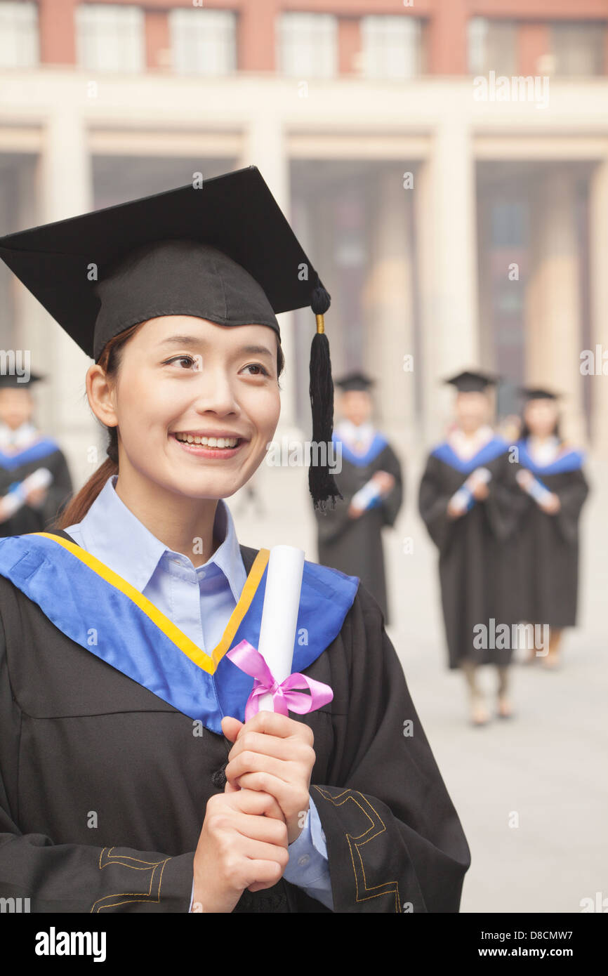 Young Female Graduate Holding Diploma Stock Photo - Alamy