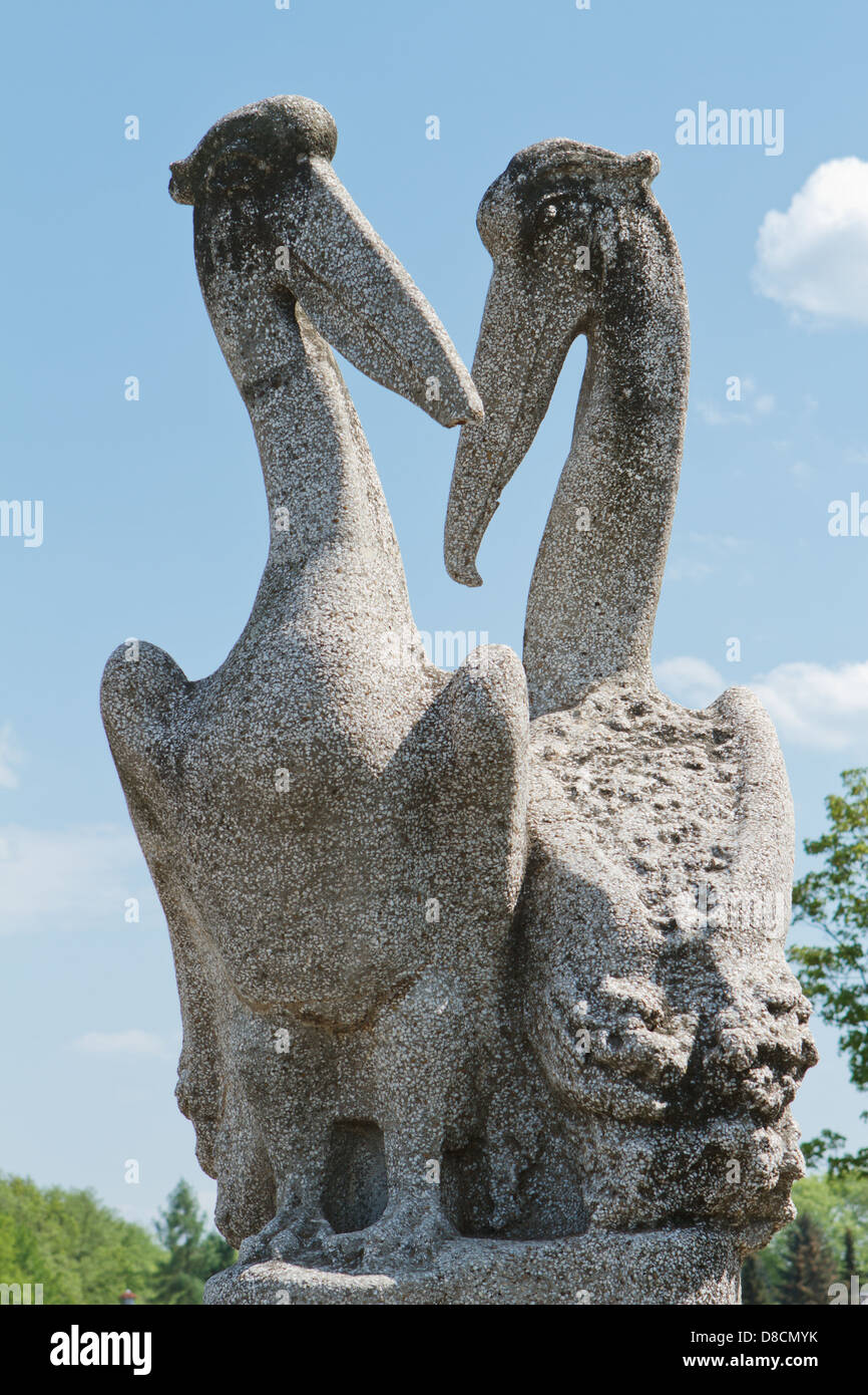 A pair of pelicans - sculpture in a public park. Stock Photo