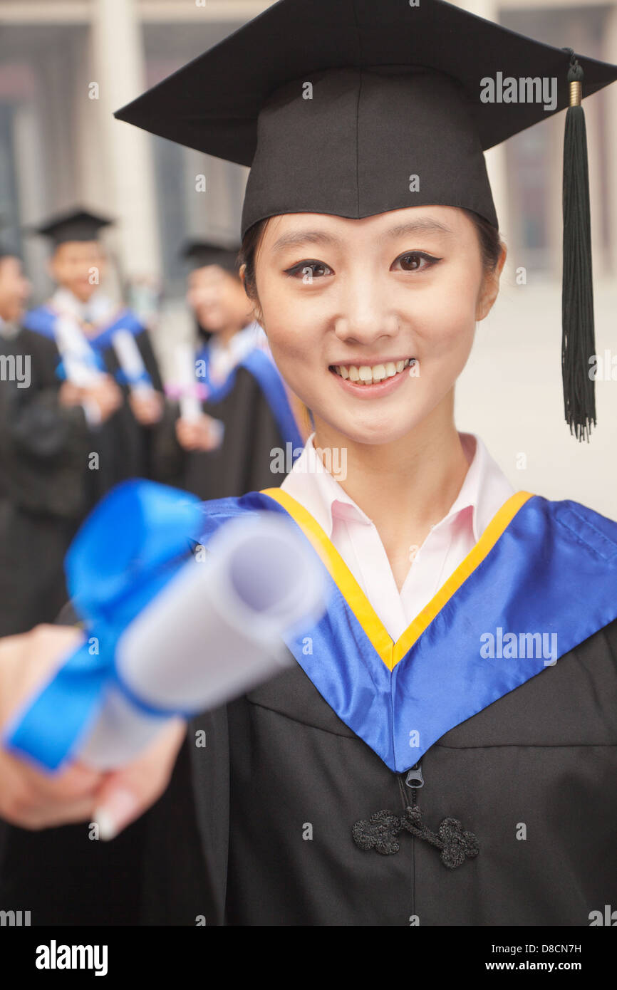 Young Female Graduate Holding Diploma Stock Photo - Alamy