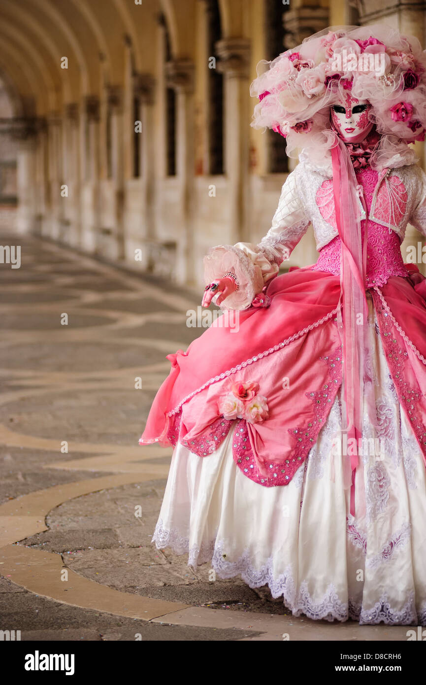 A woman posing her Carnival mask and dress at the Doge's Palace during the  Venetian Carnival, Italy Stock Photo - Alamy