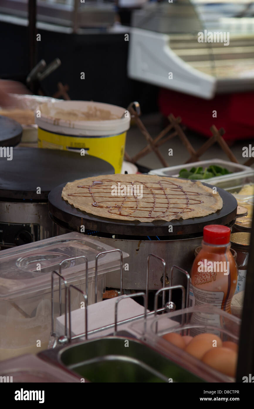 Chocolate crepe maker market stall yummy delicious food eat delicate pretty eggs outside Stock Photo
