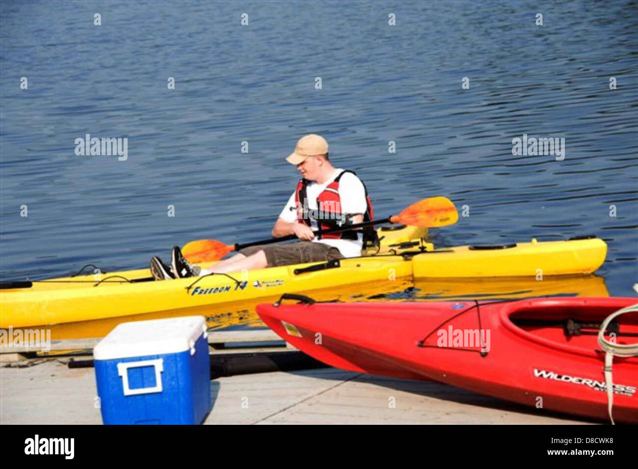 Man prepares to go canoeing Stock Photo Alamy