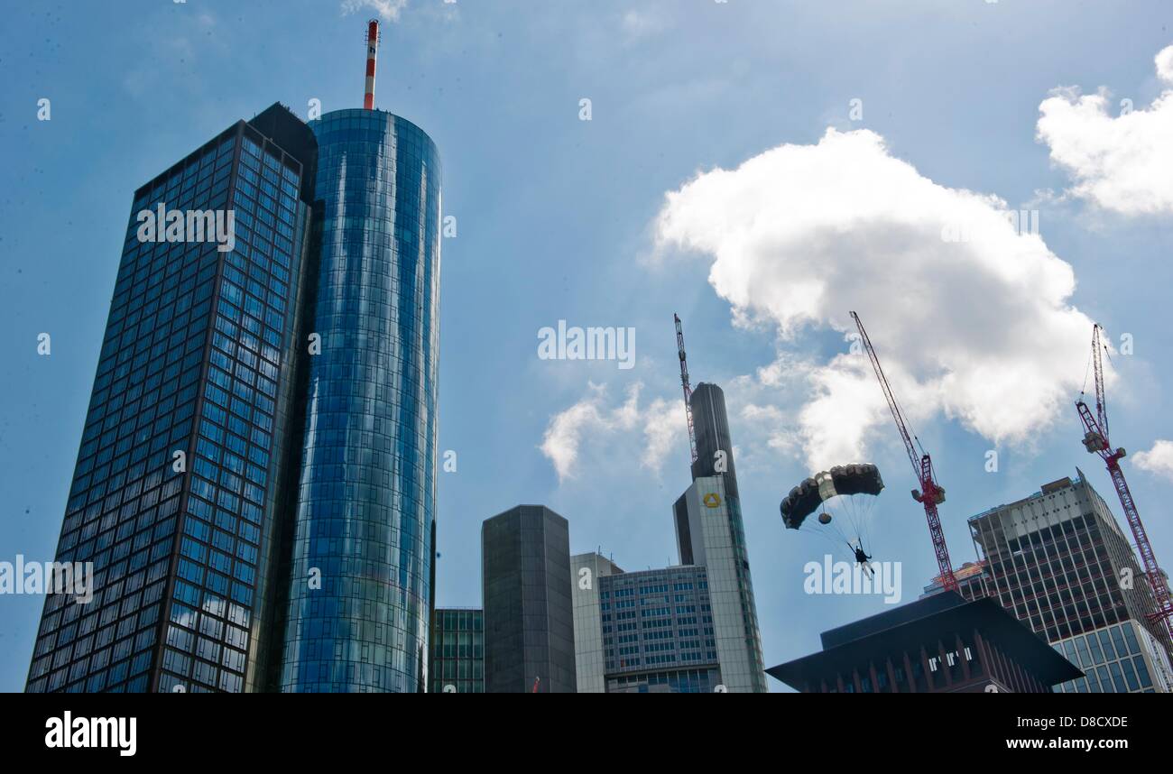A Base jumper sails after his jump off the Main tower (200m) with a  parachute to the earth during the skyscraper festival in Frankfurt/Main,  Germany, 25 May 2013. Several hundred thousand visitors