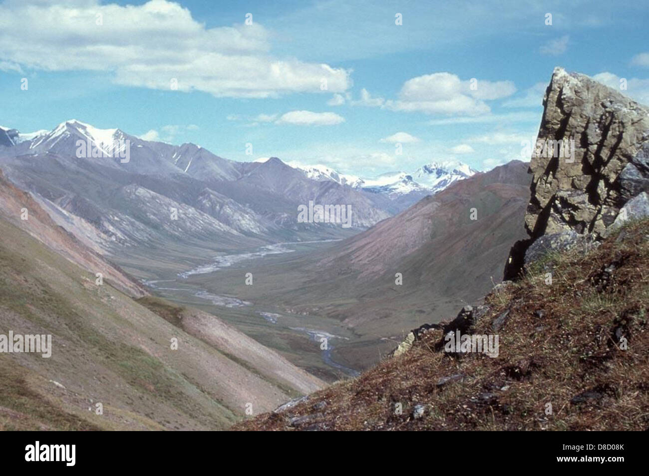 A panoramic view of a mountain valley, showcasing sweeping views of ...