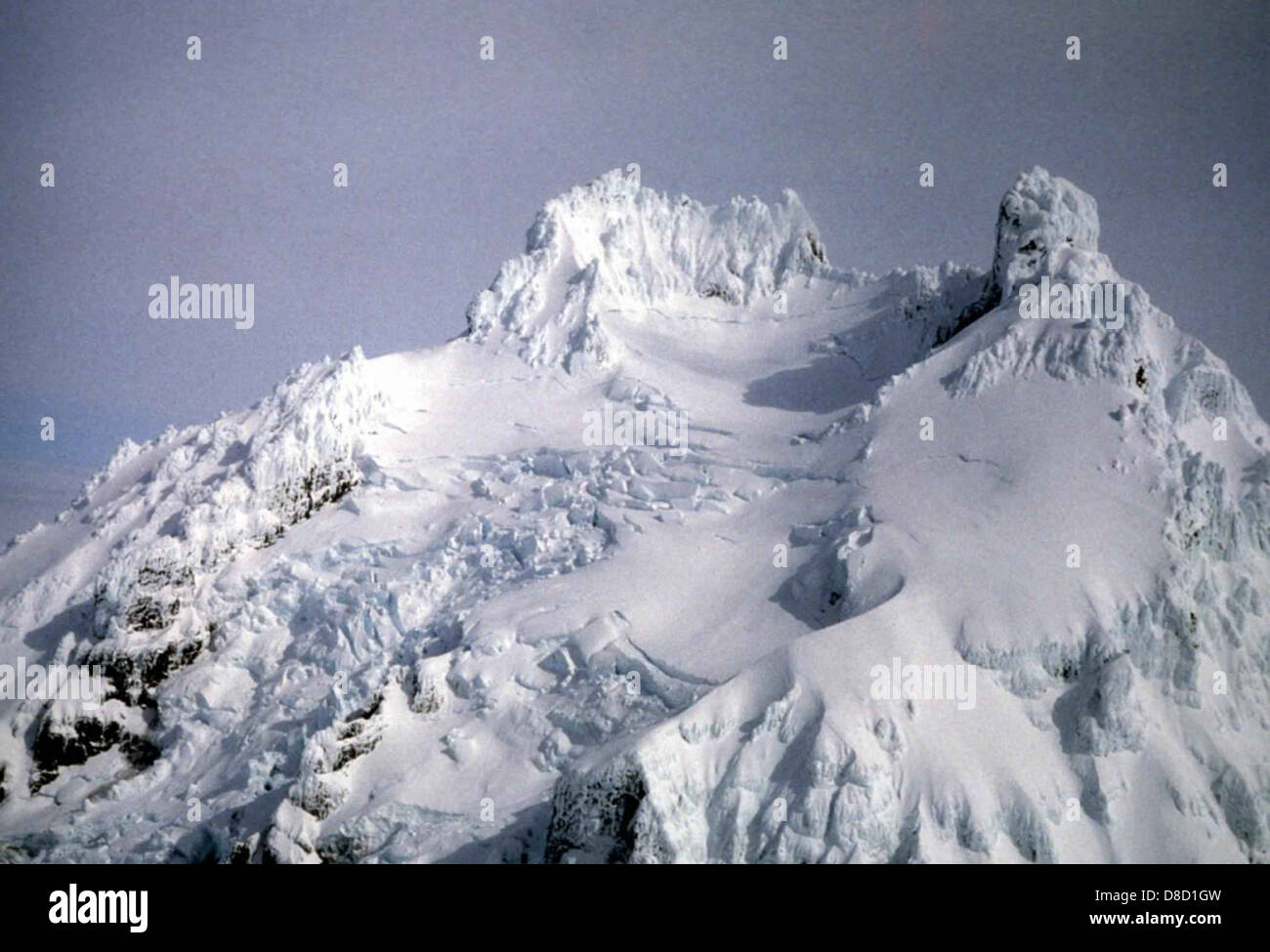 Isanotski Volcano, located in the Aleutian Islands, is covered with a ...