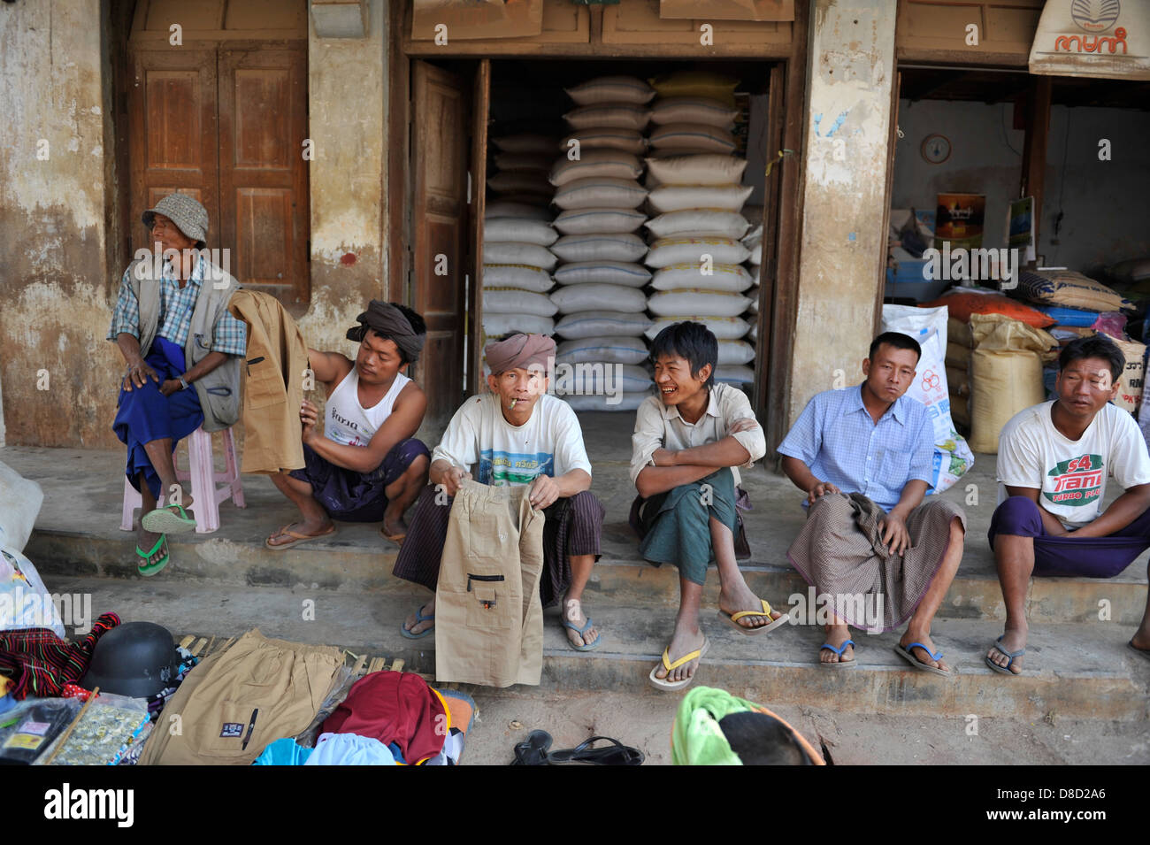 Blue collar workers waiting at the Aungban market Stock Photo