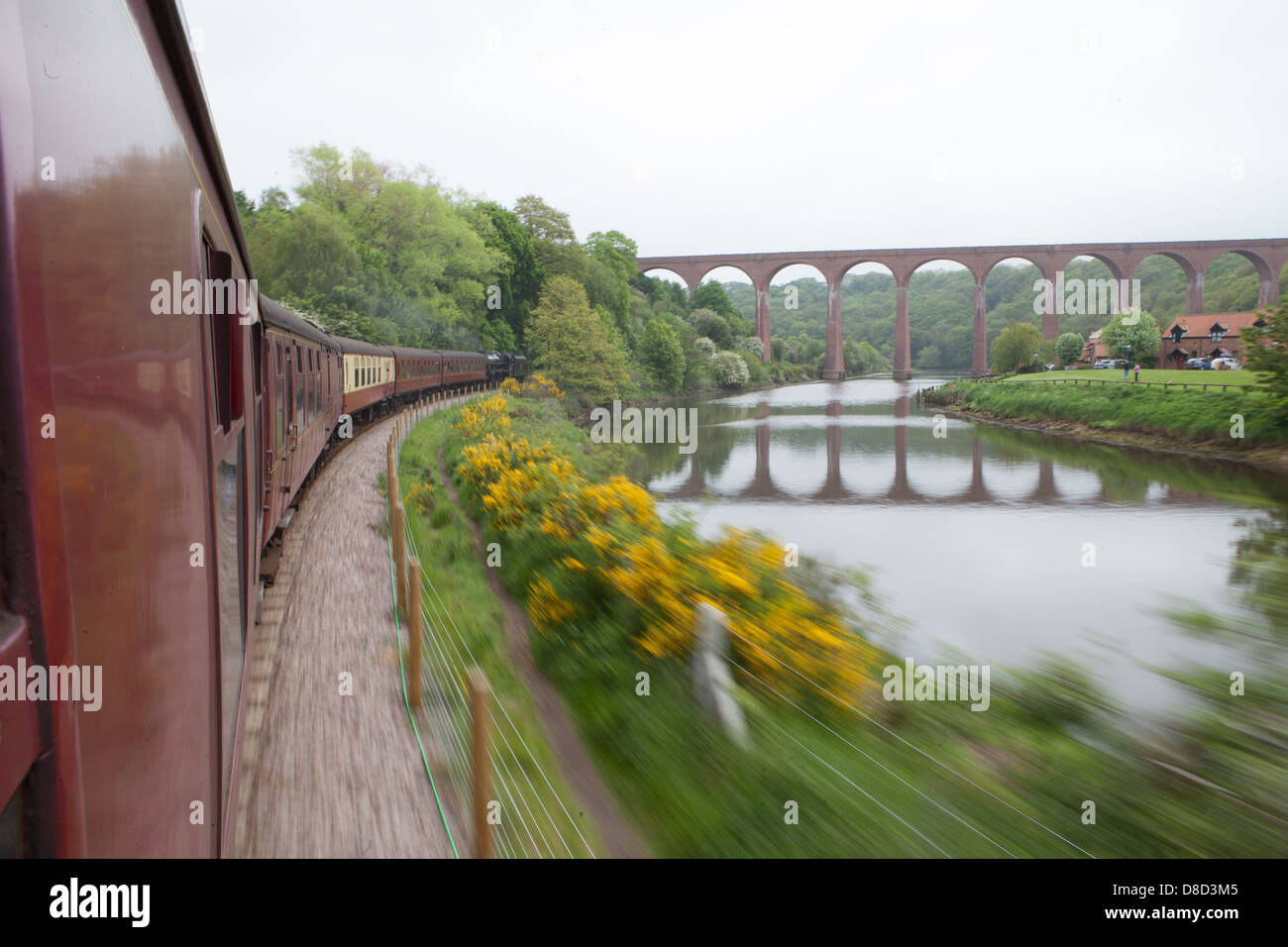Railway Train Passing speeding Fast scene bridge with calm shadow Stock Photo