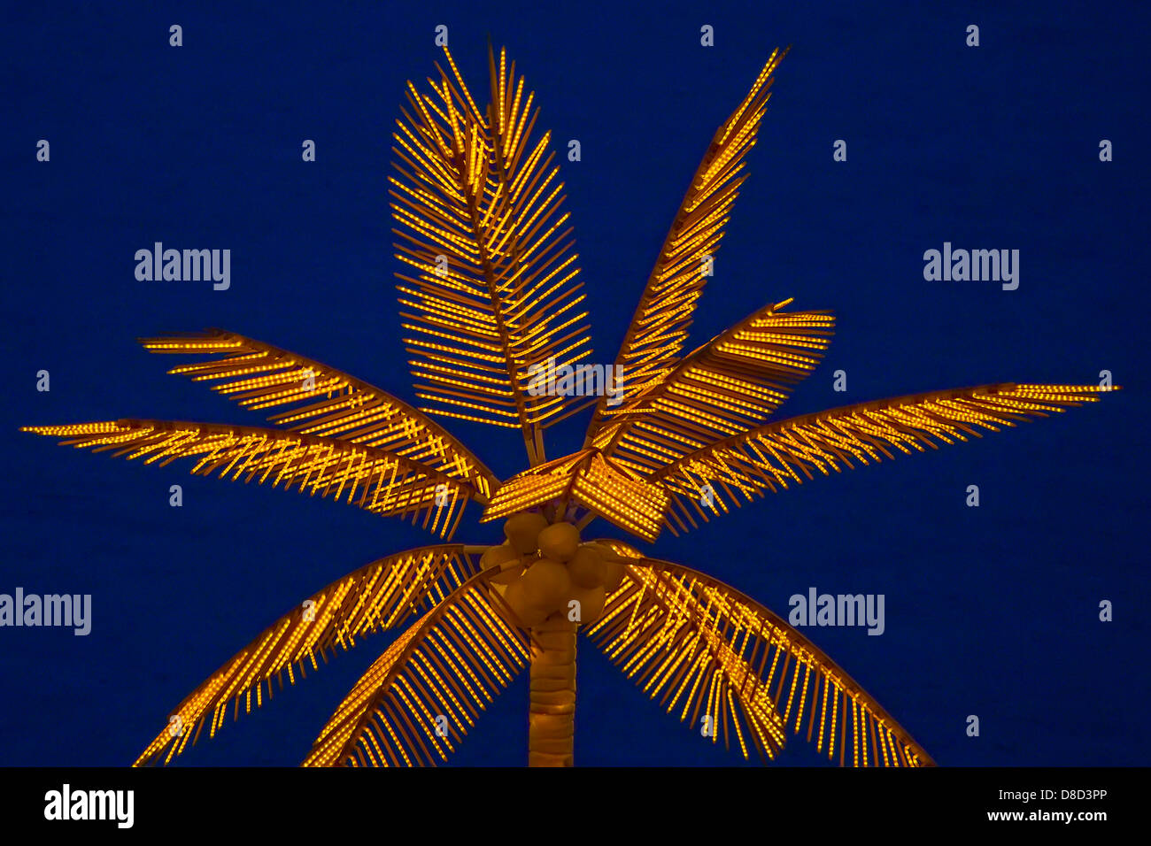 Palm tree made of lights lit up at night Stock Photo