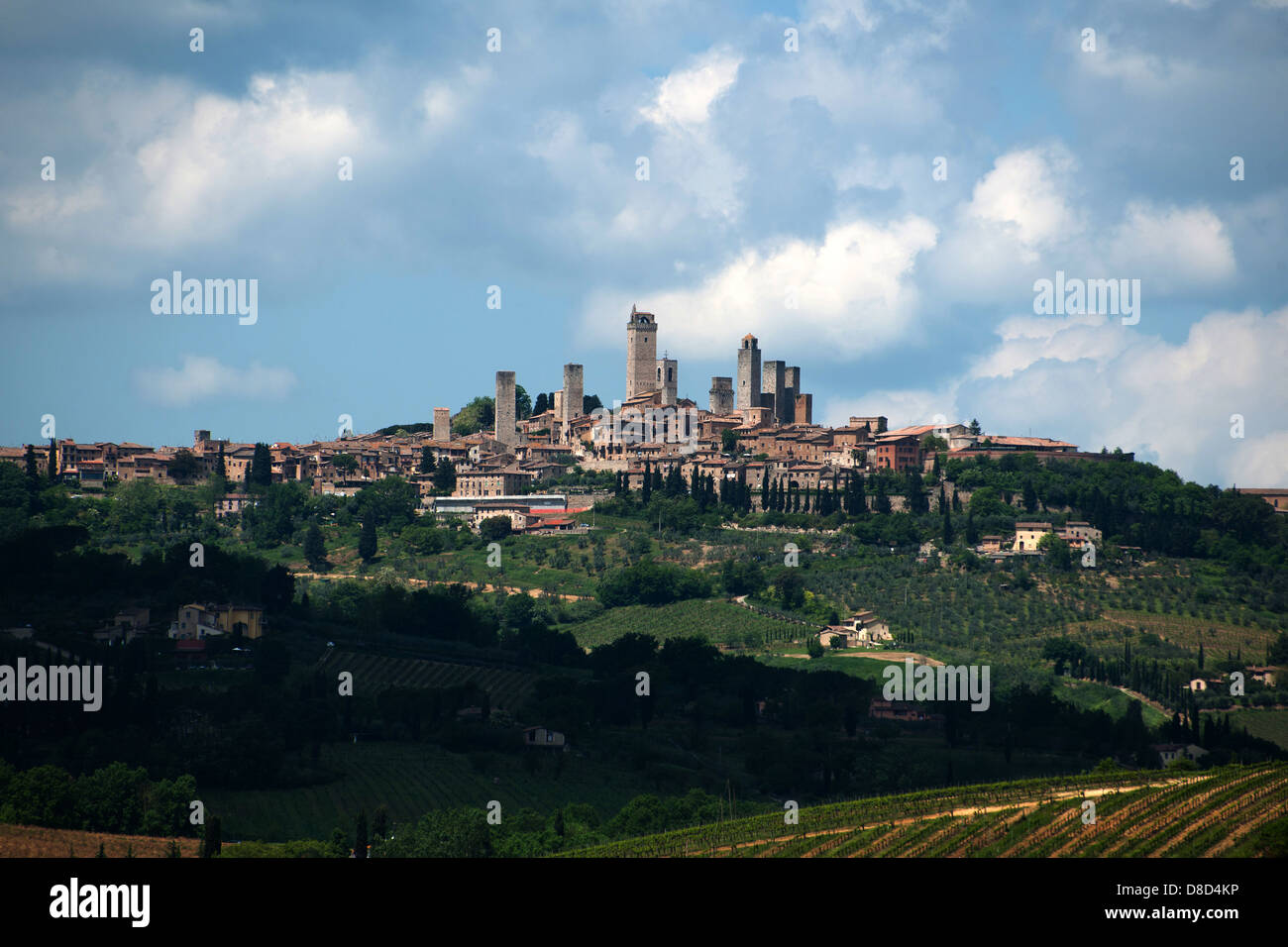 The hilly landscape of Tuscany with Medieval hilltop town of San Gimignano, Tuscany, Italy, Europe Stock Photo