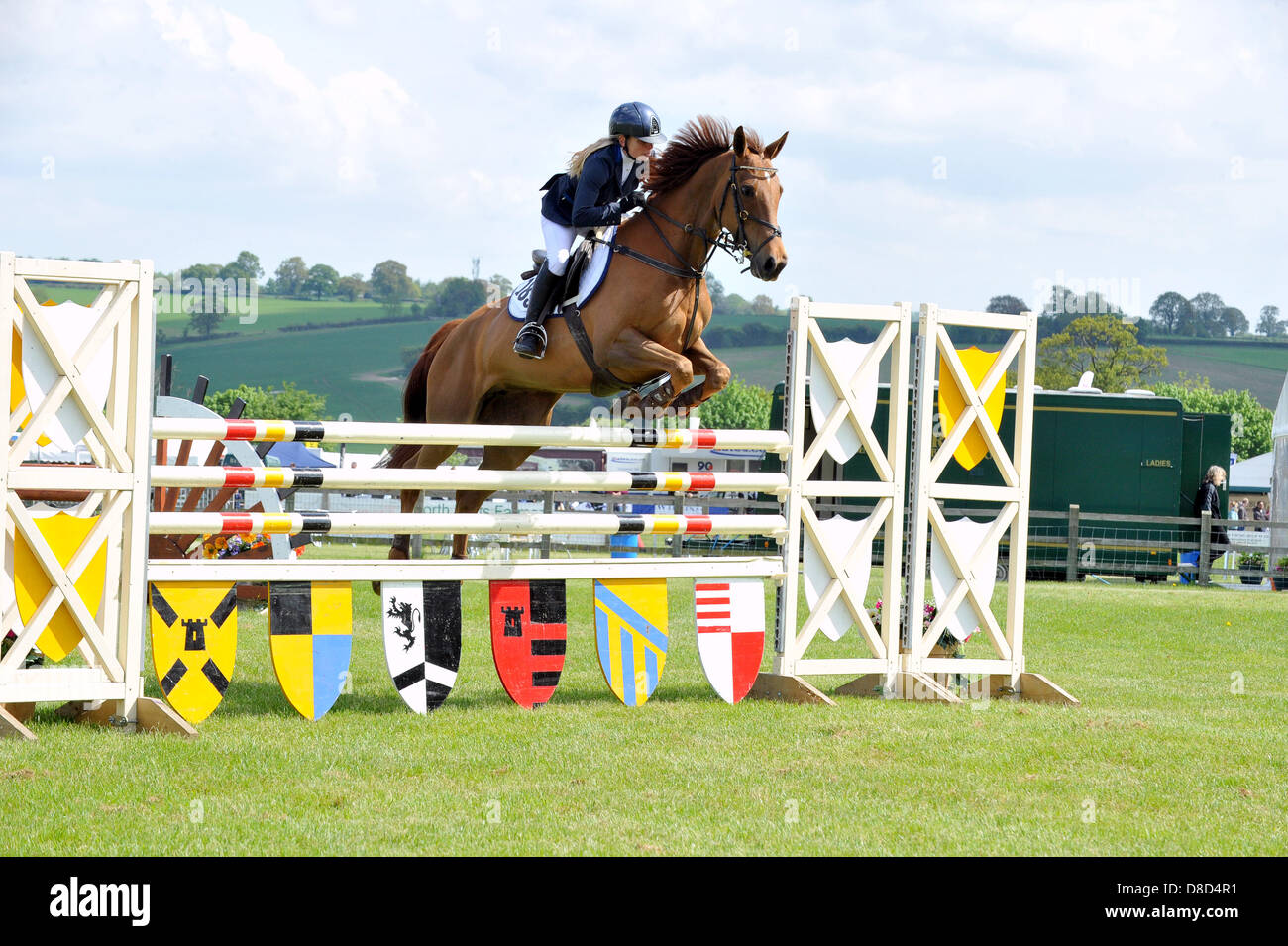 REDBOURN, UK. 25th May 2013. Show jumping at the Hertfordshire County Show. Lucinda Turner competes in the Foxhunter 1.20m Open class. Stock Photo