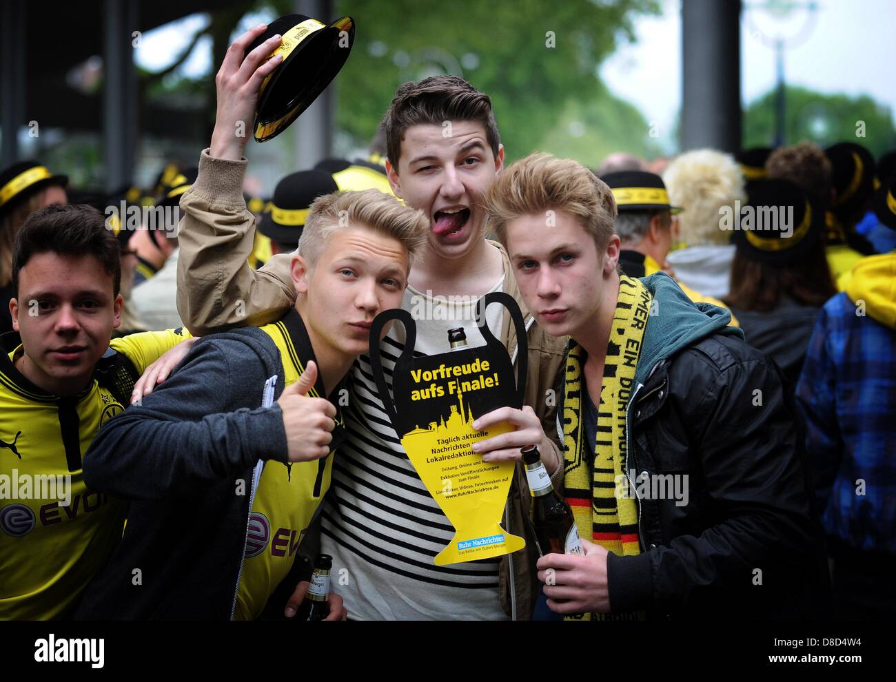 Fans of Dortmund pose for the camera prior to a public viewing of the UEFA Champions League