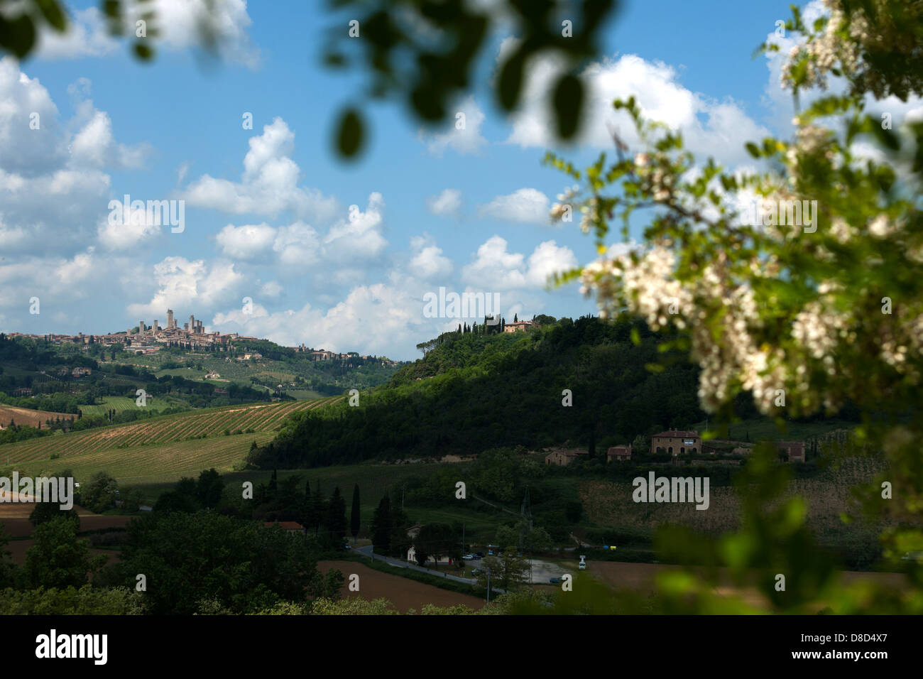 The extensive hilly landscape of Tuscany with Medieval hilltop town of San Gimignano, Tuscany, Italy, Europe Stock Photo