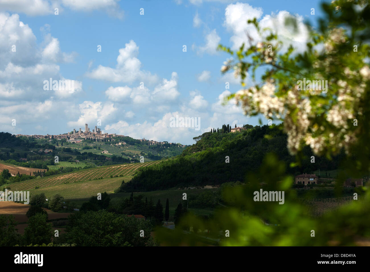 The extensive hilly landscape of Tuscany with Medieval hilltop town of San Gimignano, Tuscany, Italy, Europe Stock Photo
