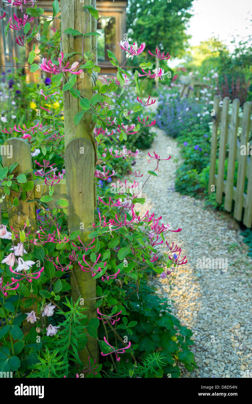 English Cottage Garden in  full bloom Gloucetsershire UK Stock Photo