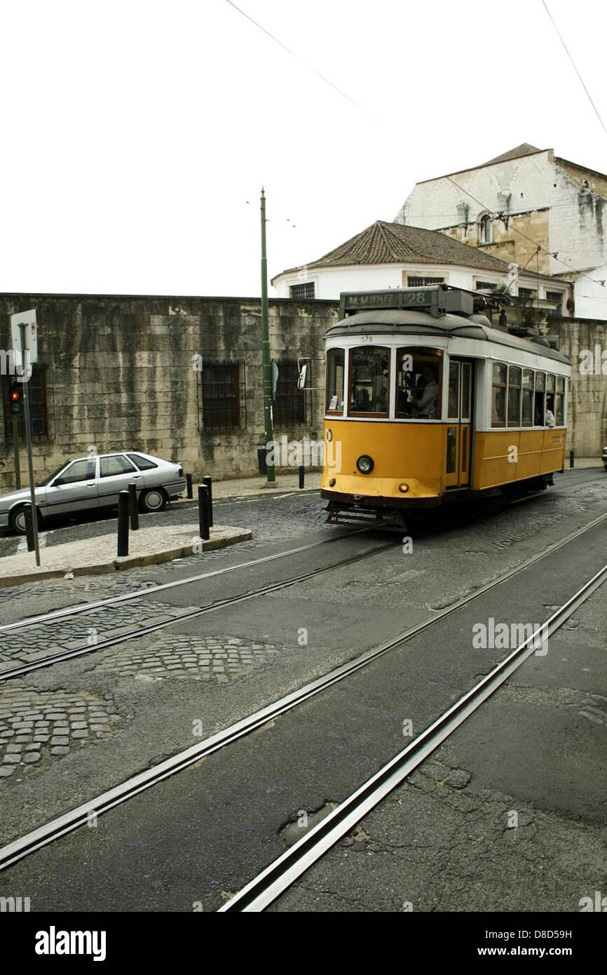 A railbus is seen on a street, combining the features of both a train ...