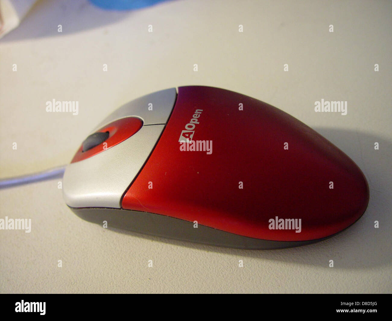 A red optical computer mouse from Aopen, featuring a sleek, ergonomic ...