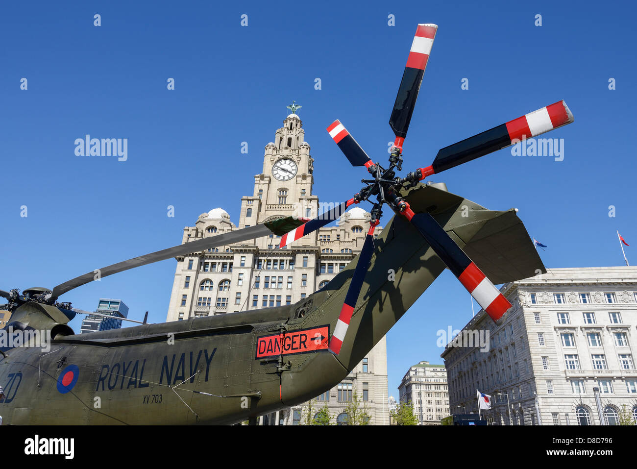 Liverpool, UK. 25th May 2013. As part of the 70th anniversary of the Battle of the Atlantic, a Royal Navy helicopter is positioned in front of the Liver Building at the Pier Head as part of the Bank Holiday Weekend festival of activities. Credit: Andrew Paterson/Alamy Live News Stock Photo