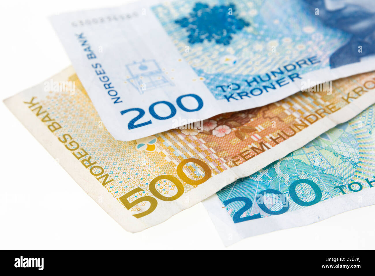 Three Norwegian 200 and 500 Kroner banknotes on a plain white ...