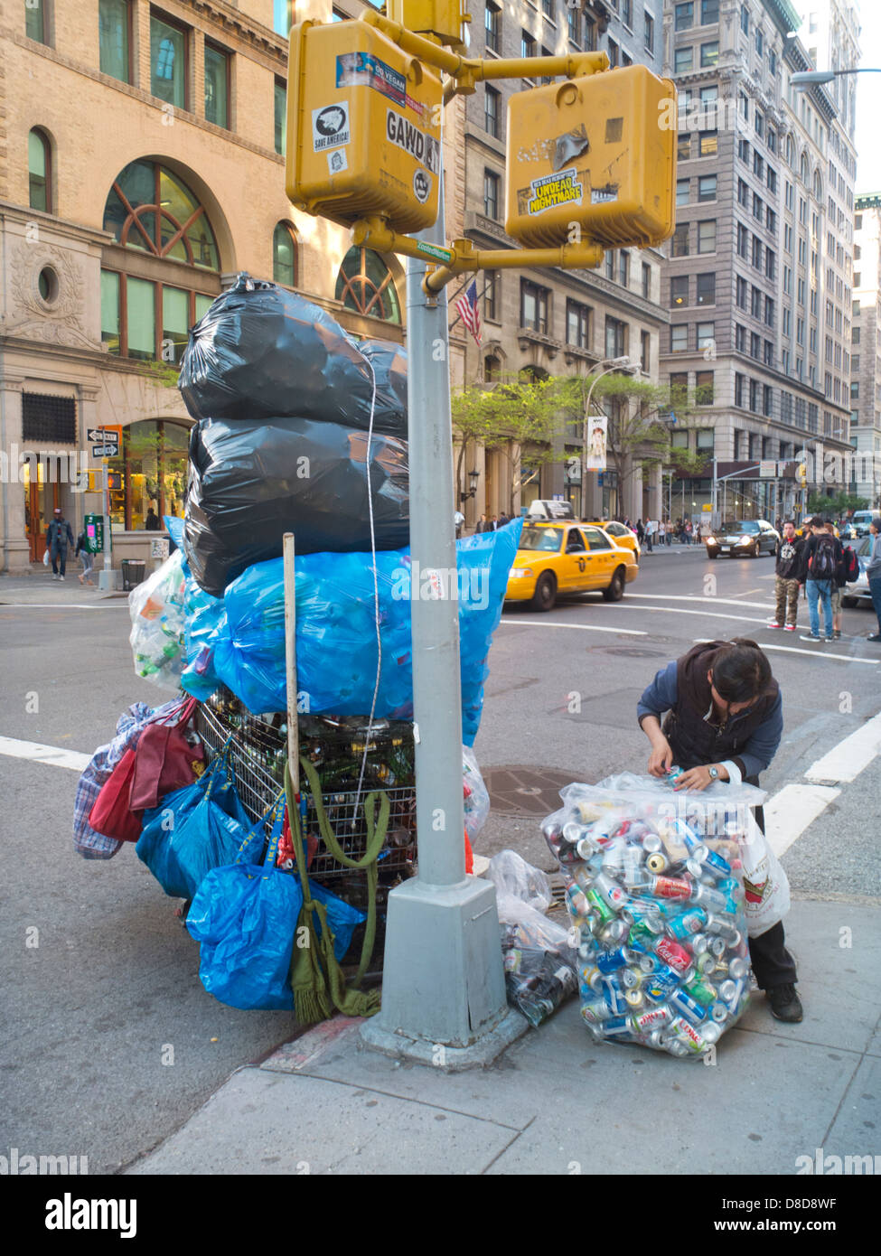 homeless person collecting cans in New York City Stock Photo Alamy