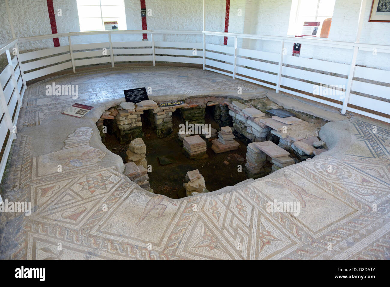 Collapsed floor revealing a hypocaust system, Bignor Roman villa, Bignor, West Sussex, UK Stock Photo