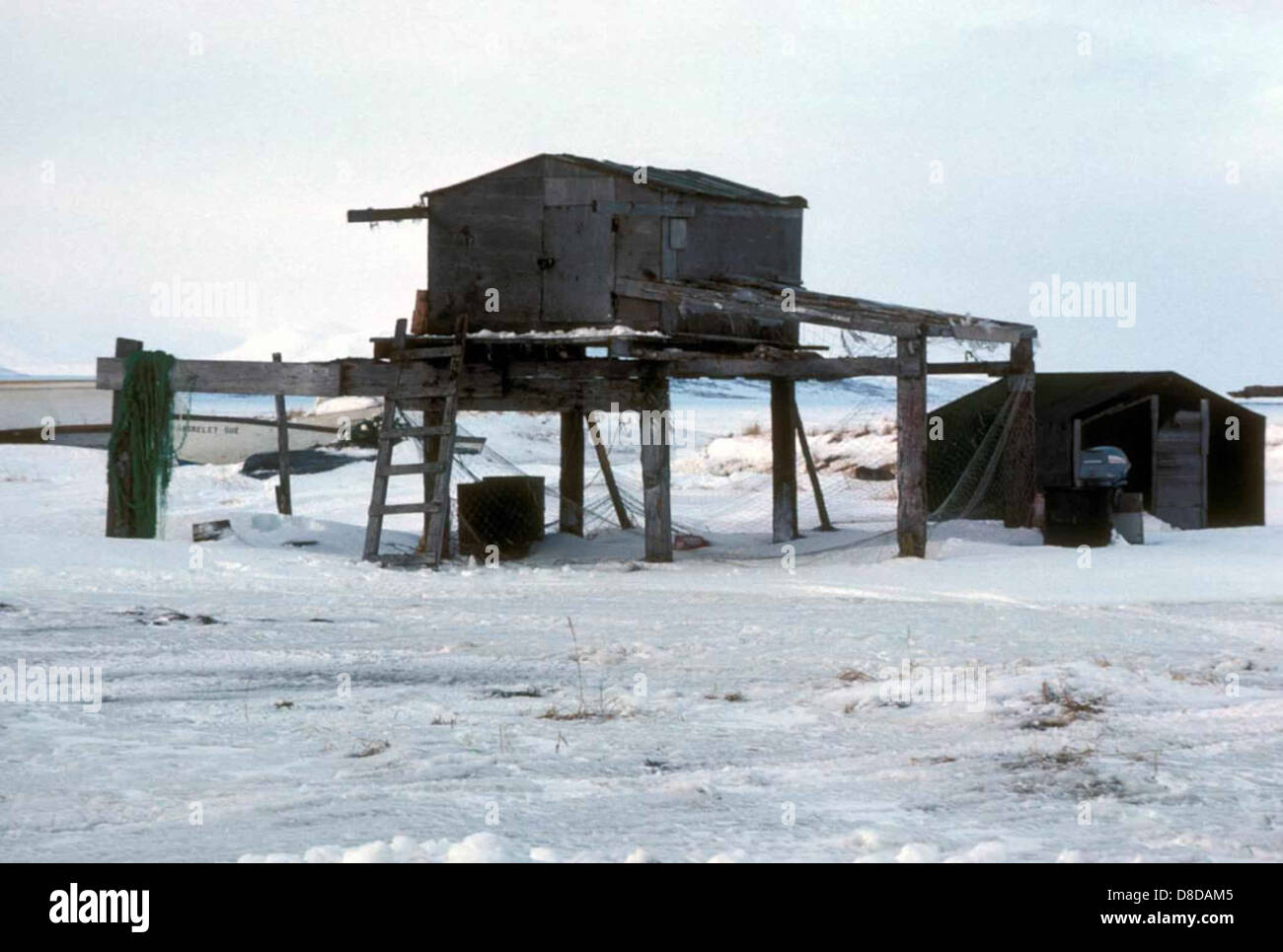 A fishing cache is seen standing near the shore, typically used by ...