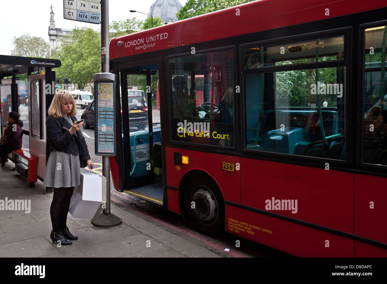 Woman waiting bus hi-res stock photography and images - Alamy