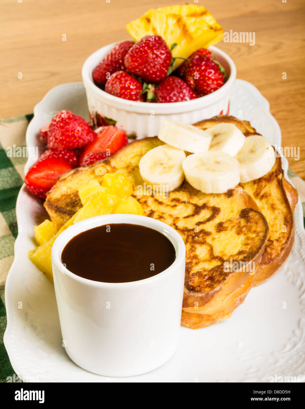 French toast with strawberries pineapple bananas and coffee Stock Photo Alamy