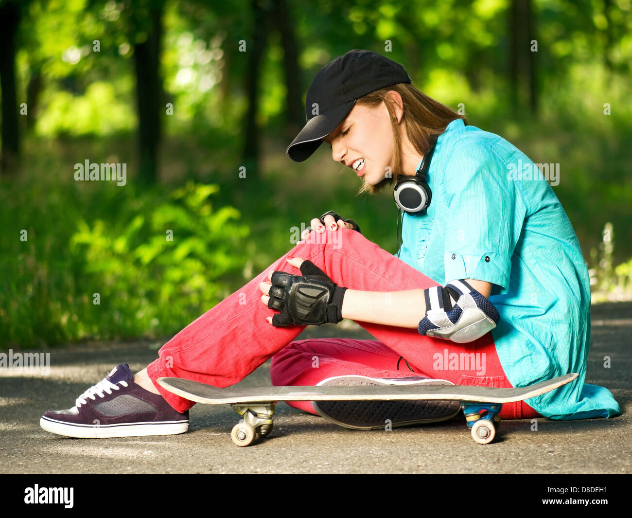 Teenage girl with skateboard Stock Photo