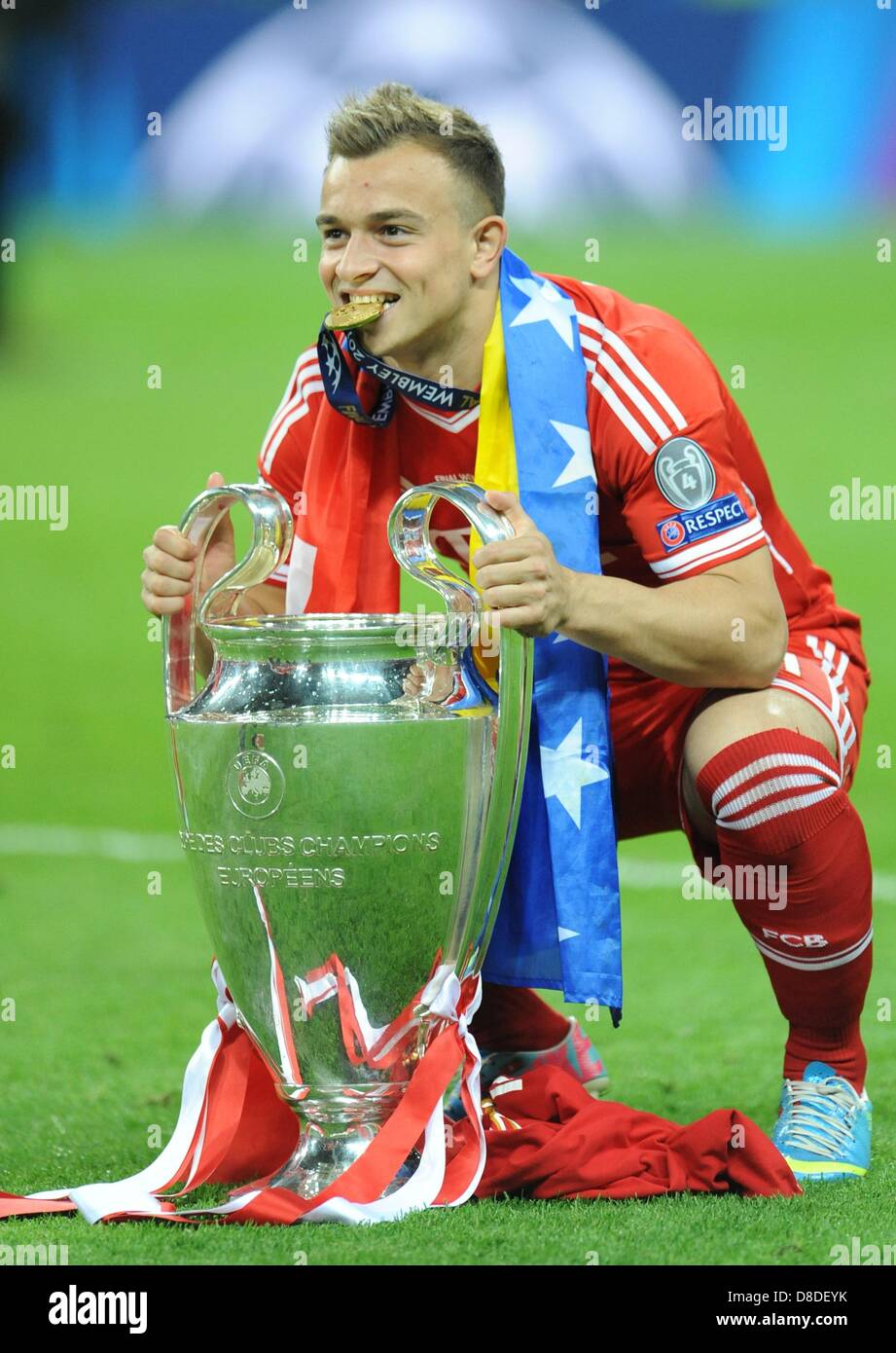 London, UK. 25th May, 2013. Munich's Xherdan Shaqiri celebrates with the  trophy after winning the UEFA soccer Champions League final between  Borussia Dortmund and Bayern Munich at Wembley stadium in London, England,