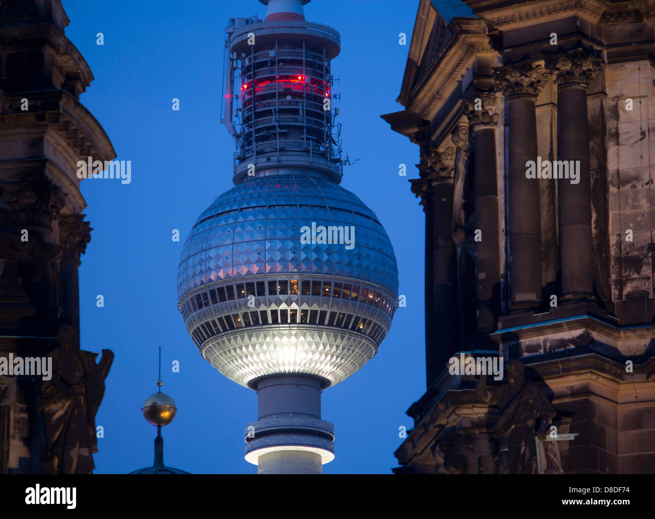 Fernsehturm TV Tower seen between towers of Berliner Dom at twilight / dusk / night Mitte Berlin Germany Stock Photo