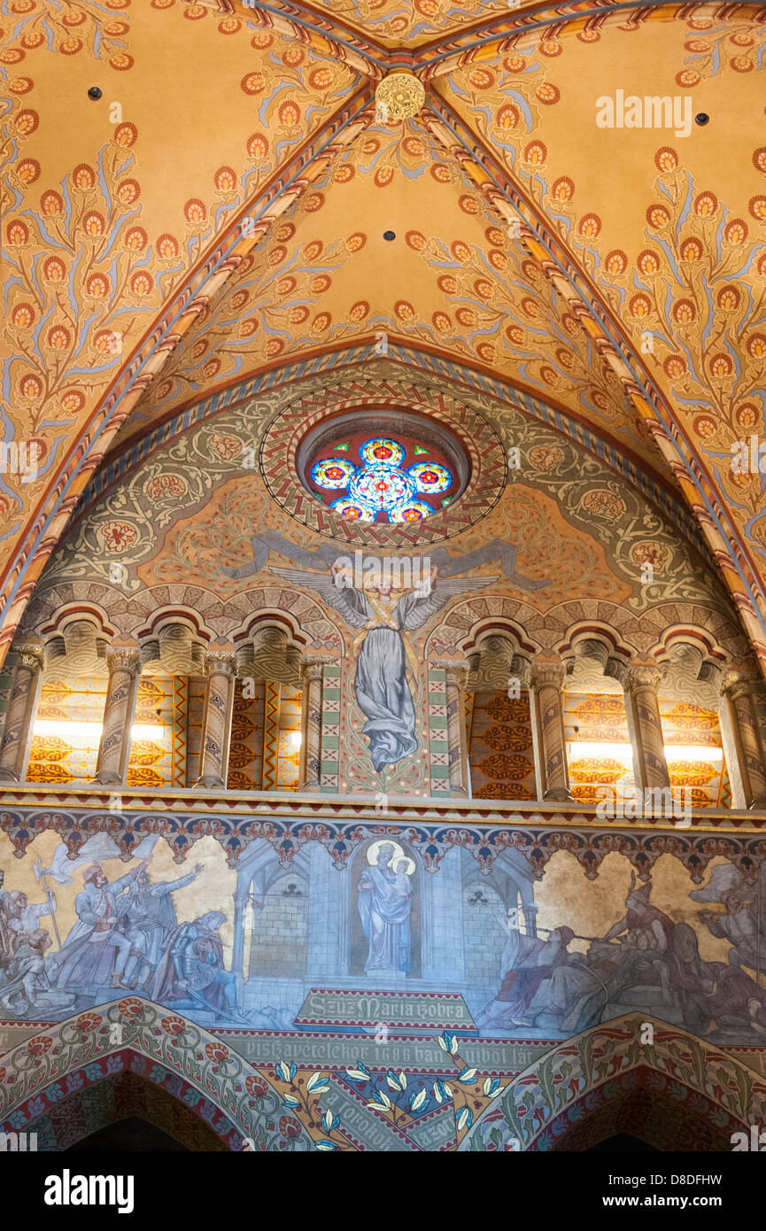 Hungary Budapest Holy Trinity Square Baroque Matyas Templom Matthias Church built 1255 by Franciscan Friars interior detail mural arches stained glass Stock Photo