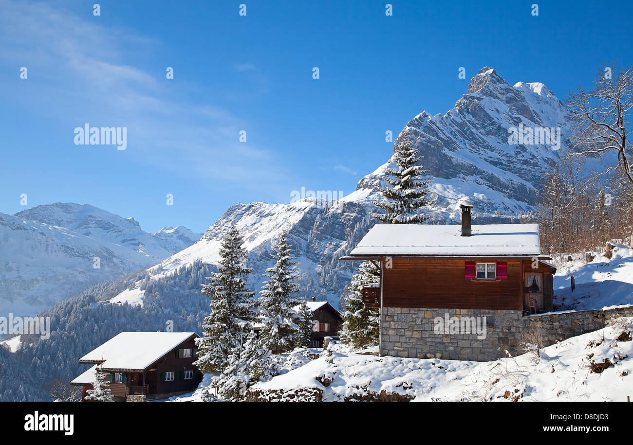 Winter holiday house in swiss alps Stock Photo - Alamy