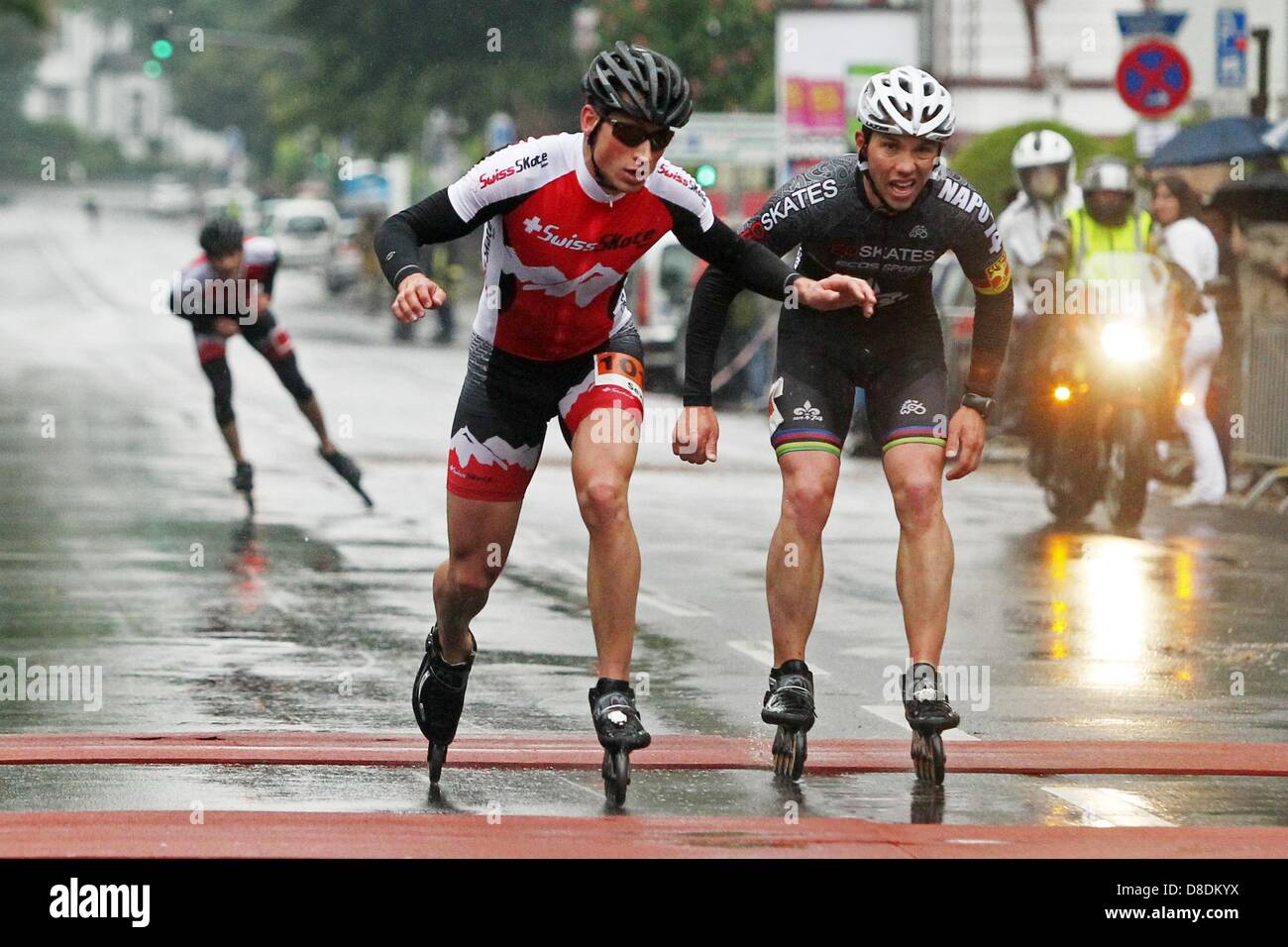 Switzerland's Severin Widmer (L) wins the inline-skating event of Middle  Rhine Marathon in front of compatriot Julien Levrard in Koblenz, Germany,  26 May 2013. Arond 6,000 runners and skaters took part in